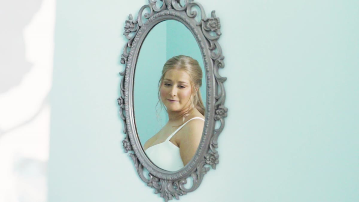 A cinematic wedding detail frame from Kaitlyn and Kyle's film