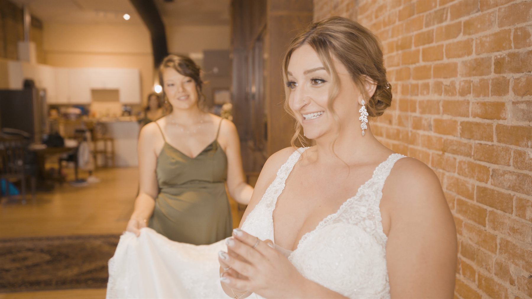 Emily smiling in her wedding dress before the ceremony
